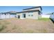 A fully fenced backyard with a patio, perfect for entertaining guests at 35853 Buttonweed Trl, Zephyrhills, FL 33541