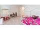 Cozy ' bedroom with a unique house-shaped bed frame and vibrant decor, perfect for play and rest at 35853 Buttonweed Trl, Zephyrhills, FL 33541