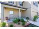 Inviting front porch with a decorative garden, enhancing the home's curb appeal at 35853 Buttonweed Trl, Zephyrhills, FL 33541