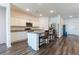 Kitchen island and stainless appliances, creating a modern and inviting atmosphere at 35853 Buttonweed Trl, Zephyrhills, FL 33541