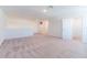 Expansive loft area with plush carpeting, offering flexible space for recreation or relaxation at 35853 Buttonweed Trl, Zephyrhills, FL 33541
