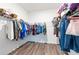 Spacious walk-in closet with ample storage and wire shelving, ready for organization and personal touches at 35853 Buttonweed Trl, Zephyrhills, FL 33541