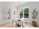 Bright dining room with modern lighting and view of the backyard at 3910 W San Carlos St, Tampa, FL 33629