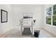 Bright dining room featuring a white table, decor and an area rug at 3910 W San Carlos St, Tampa, FL 33629