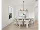 Well-lit dining room featuring a contemporary chandelier and stylish decor at 3910 W San Carlos St, Tampa, FL 33629