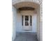 Close-up of an elegant front entryway with a brick arch and a classic white door, creating a welcoming first impression at 3910 W San Carlos St, Tampa, FL 33629