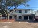 Stunning two-story home featuring a modern exterior with brick accents and a spacious two-car carport for convenience and style at 3910 W San Carlos St, Tampa, FL 33629