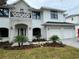 Beautiful two-story home featuring brick accents, balcony, arched entryway, and attached two-car garage at 3910 W San Carlos St, Tampa, FL 33629