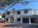 Newly constructed two-story home boasting a modern architectural style with a brick accent, and a convenient two-car carport at 3910 W San Carlos St, Tampa, FL 33629
