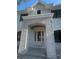 Elegant entryway with a brick archway leading to a stylish front door, enhancing the home's curb appeal at 3910 W San Carlos St, Tampa, FL 33629
