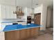 Spacious kitchen featuring white cabinets, a center island with counter seating, and stainless steel appliances at 3910 W San Carlos St, Tampa, FL 33629
