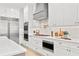 Well-equipped kitchen features stainless steel appliances, white cabinets, and ample counter space at 3910 W San Carlos St, Tampa, FL 33629