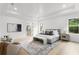 This main bedroom suite features a walk-in closet, hardwood floors, and decorative artwork at 3910 W San Carlos St, Tampa, FL 33629