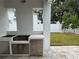 Outdoor kitchen complete with stainless steel appliances and plenty of counter space, perfect for entertaining at 3910 W San Carlos St, Tampa, FL 33629