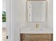 A powder room features a white marble vanity and modern fixtures at 3910 W San Carlos St, Tampa, FL 33629