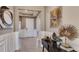 Bright and welcoming entryway with tile flooring, decorative mirror, and stylish console table at 4028 Harvest Hearth Pl, Plant City, FL 33565
