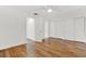 Spacious bedroom with hardwood floors, a ceiling fan, and multiple closets for ample storage at 404 Danube Ave, Tampa, FL 33606