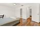 Bright bedroom with hardwood floors and access to two bathrooms for added convenience at 404 Danube Ave, Tampa, FL 33606