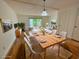 Staged dining and living space with hardwood floors, large windows, and comfortable seating at 404 Danube Ave, Tampa, FL 33606