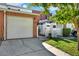 Charming brick home with attached garage and landscaped walkway to gated entrance at 404 Danube Ave, Tampa, FL 33606