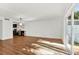 Spacious living room with hardwood floors and sliding glass doors leading to a private outdoor patio at 404 Danube Ave, Tampa, FL 33606
