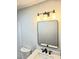 Modern bathroom features a sleek vanity with black fixtures and a contemporary mirror at 414 Danube Ave, Tampa, FL 33606