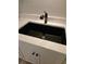 Modern bathroom sink with black faucet and white countertop at 414 Danube Ave, Tampa, FL 33606