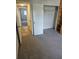 Bedroom with carpeted floors, closet, and an attached bookshelf at 414 Danube Ave, Tampa, FL 33606