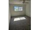 Bedroom with a fan, window, and neutral tones at 414 Danube Ave, Tampa, FL 33606