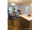 Dining area with a round glass table and seating for four next to the kitchen at 414 Danube Ave, Tampa, FL 33606