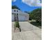 Home exterior view with driveway and mature landscaping at 414 Danube Ave, Tampa, FL 33606