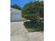 Home exterior view with driveway and mature landscaping at 414 Danube Ave, Tampa, FL 33606