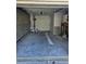 View of the garage with AC, water heater, and room for storage and projects at 414 Danube Ave, Tampa, FL 33606