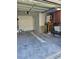 View of the garage with AC, water heater, and room for storage and projects at 414 Danube Ave, Tampa, FL 33606