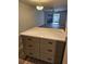 Kitchen island with light countertops and backyard view enhances the kitchen's appeal at 414 Danube Ave, Tampa, FL 33606