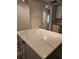 Kitchen island with white countertop and gray cabinets at 414 Danube Ave, Tampa, FL 33606