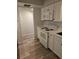 Bright kitchen features white cabinets, modern appliances, and wood flooring for a clean and inviting atmosphere at 414 Danube Ave, Tampa, FL 33606
