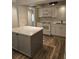 Bright kitchen with white cabinets, stainless steel appliances, and island at 414 Danube Ave, Tampa, FL 33606