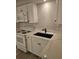 Bright kitchen with white cabinets, sleek countertops, modern appliances, and a stylish black faucet at 414 Danube Ave, Tampa, FL 33606