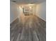 Living room featuring hardwood floors and neutral tones at 414 Danube Ave, Tampa, FL 33606