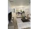 Open-concept living room with modern furnishings and a view of the kitchen at 414 Danube Ave, Tampa, FL 33606