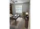 Cozy home office with natural light, ceiling fan, and classic built-in bookshelves at 414 Danube Ave, Tampa, FL 33606