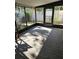 Relax in this spacious sunroom featuring natural light and peaceful backyard views at 414 Danube Ave, Tampa, FL 33606