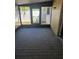 This is an enclosed sunroom with a wooden floor and a view of the backyard at 414 Danube Ave, Tampa, FL 33606