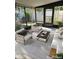 Bright and airy sunroom with comfortable seating and views of the surrounding yard at 414 Danube Ave, Tampa, FL 33606