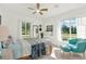 Bright, airy bedroom with lots of natural light and a colorful quilt for an inviting, homey feel at 420 48Th N St, St Petersburg, FL 33713