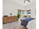 A bedroom with lots of natural light, a ceiling fan, and wood accents that create a comfortable, inviting space at 420 48Th N St, St Petersburg, FL 33713
