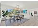 Bright dining room with modern lighting and large windows offers plenty of natural light at 420 48Th N St, St Petersburg, FL 33713