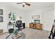 Bright office space with light wood floors, desk, ceiling fan, and large window at 420 48Th N St, St Petersburg, FL 33713