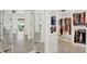 Well-organized walk-in closet with ample storage and a full-length mirror, designed for fashion enthusiasts at 420 48Th N St, St Petersburg, FL 33713